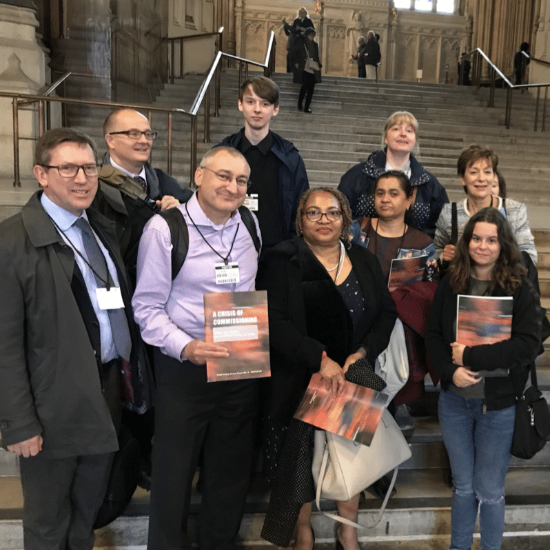 People standing on steps in Parliament