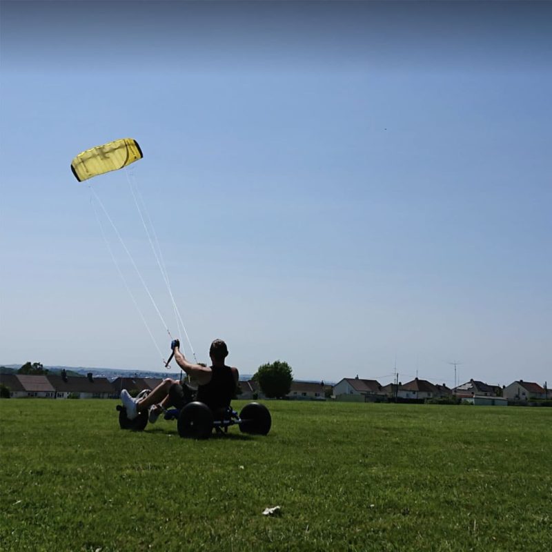 Man with FASD kitesurfing on a sunny day