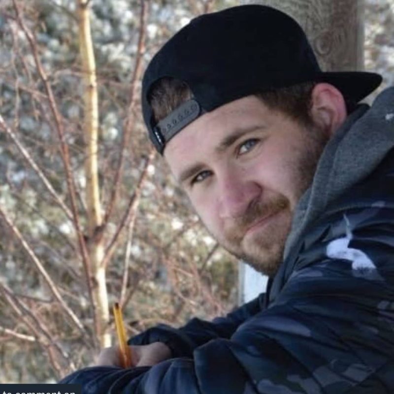 Man with FASD with baseball cap on looking at camera