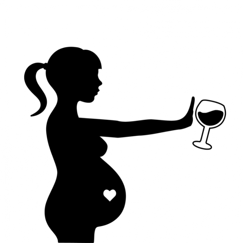Black and white image of pregnant woman refusing alcohol